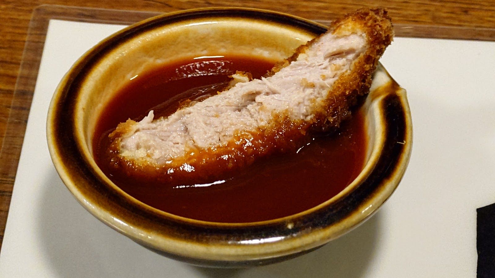 A cutlet in demi-glace sauce